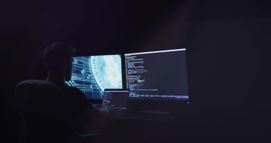 Man Coding On Computer In Dark Room