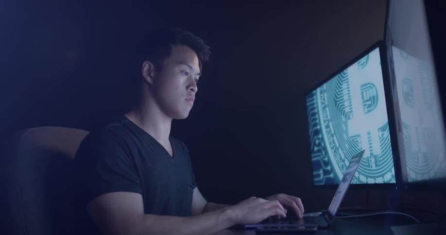 Man Coding On Computer In Dark Room