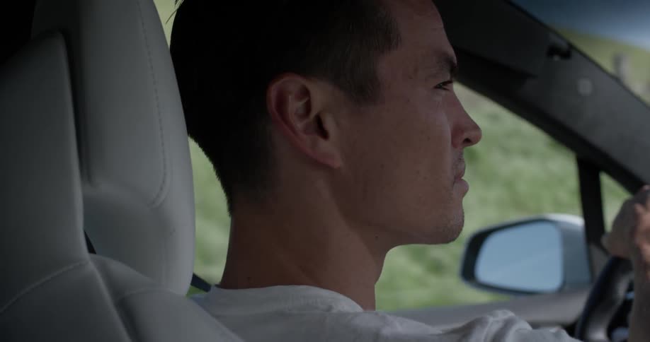 A man driving down the road