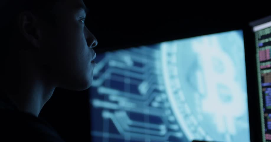 A man is looking up at a computer