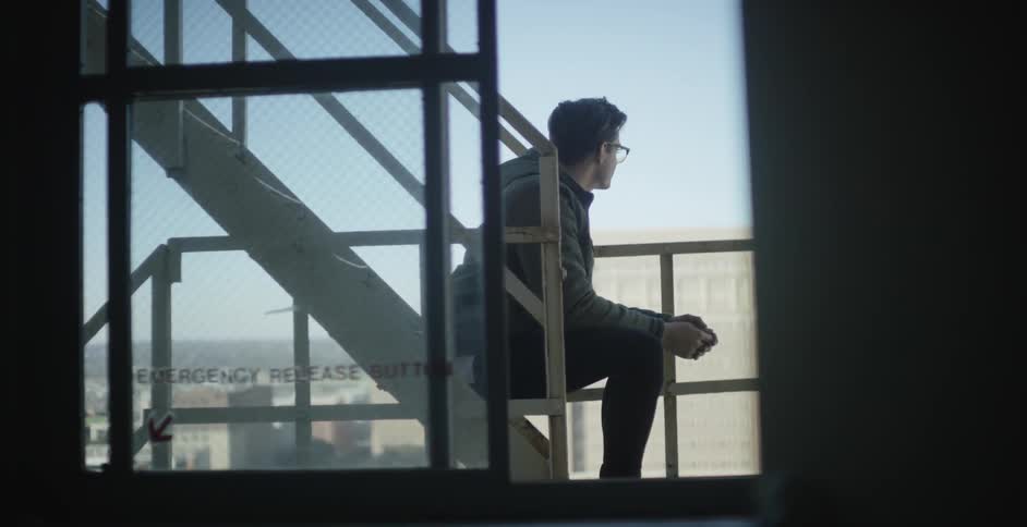 A man is looking off the tower