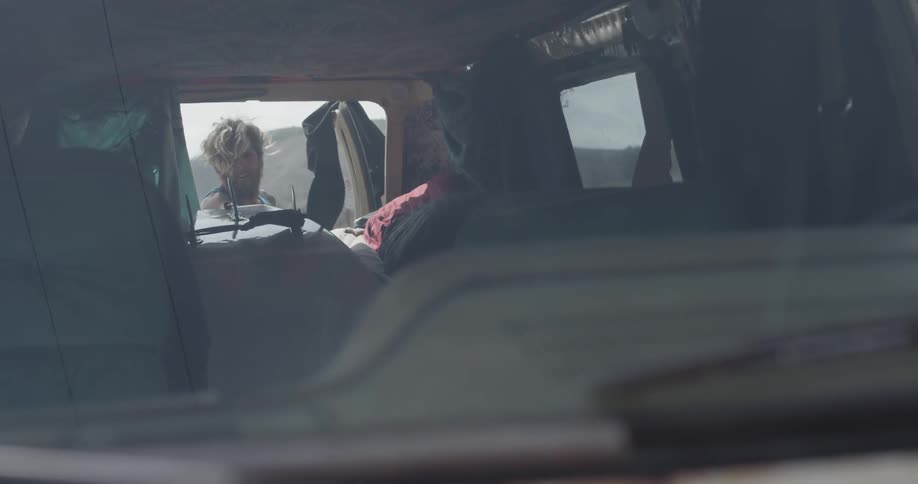 Man Driving To Beach And Surfing