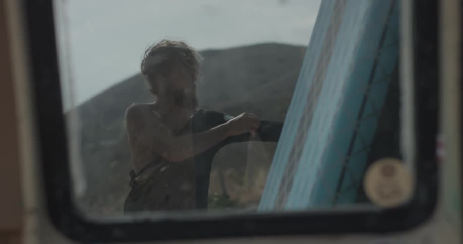 Man Driving To Beach And Surfing
