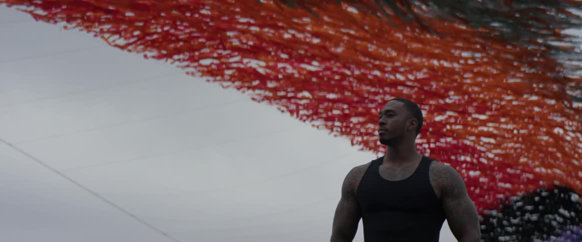 Red streamers are flying behind a man