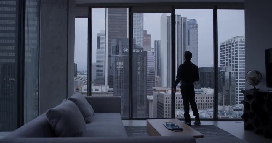 Man Inside High Rise Apartment