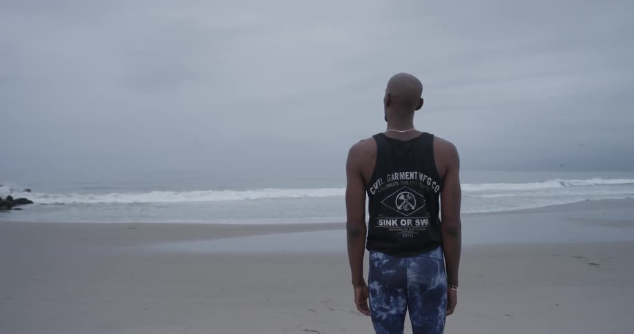 Man Meditating Outside By The Beach
