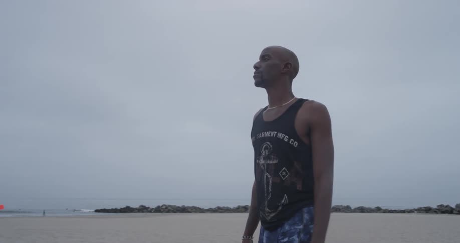 Man Meditating Outside By The Beach