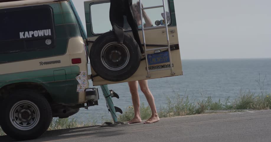 Man Driving To Beach And Surfing