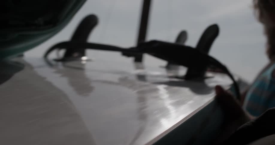 Man Driving To Beach And Surfing
