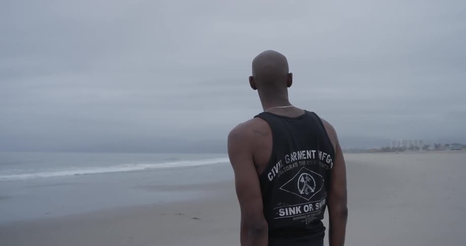 Man Meditating Outside By The Beach