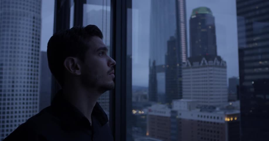 Man Inside High Rise Apartment