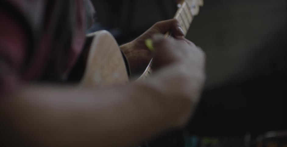 A man playing a guitar