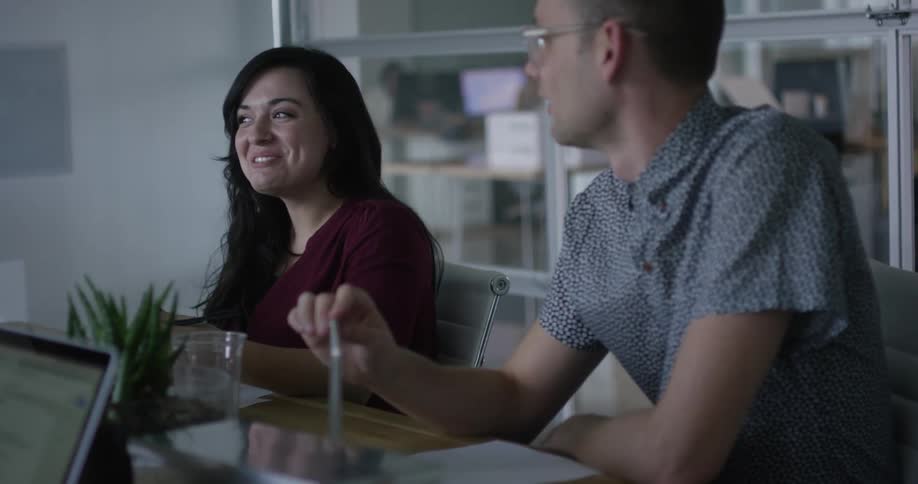 People talking and laughing in an office