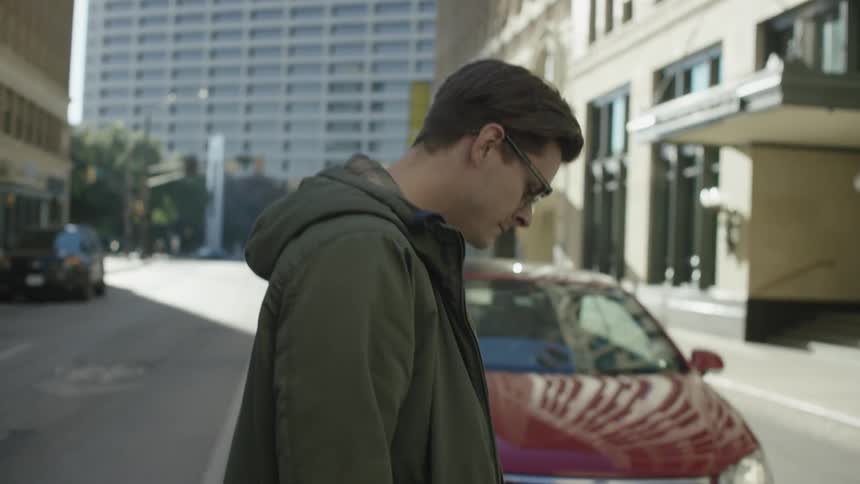 A man is walking down the street
