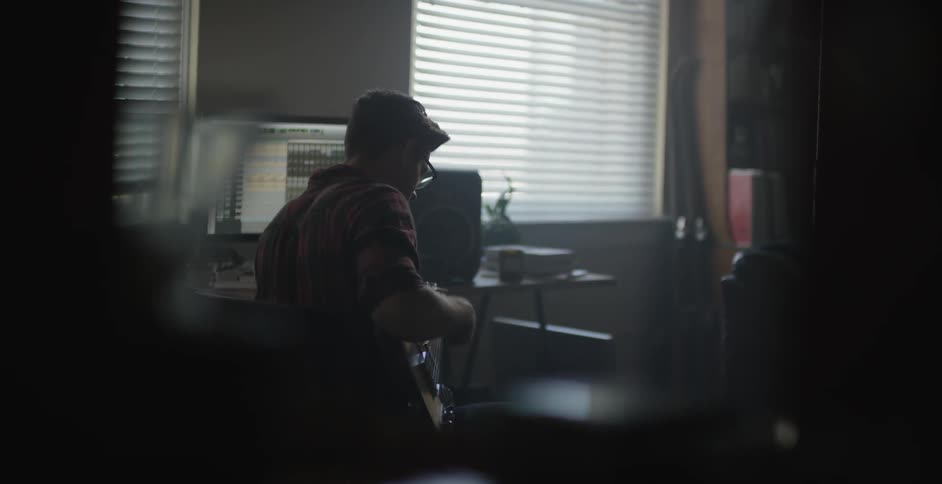 A man is playing guitar
