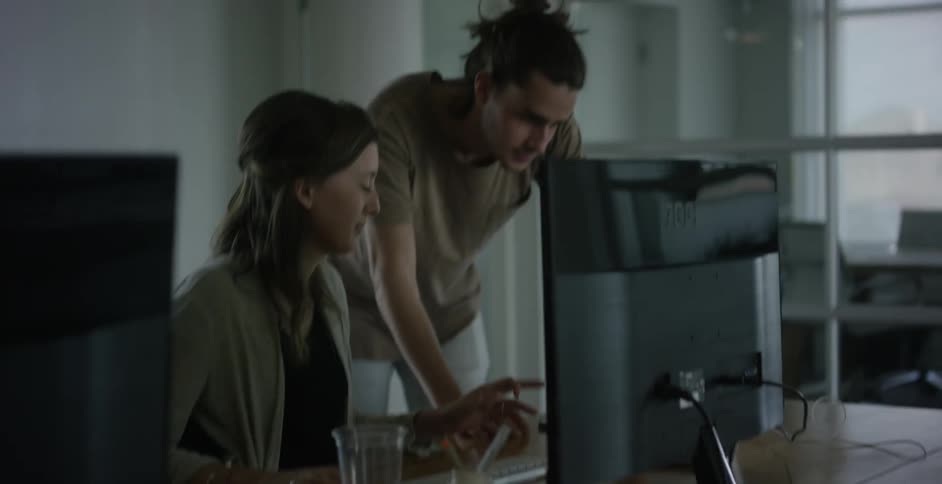 People looking at a computer