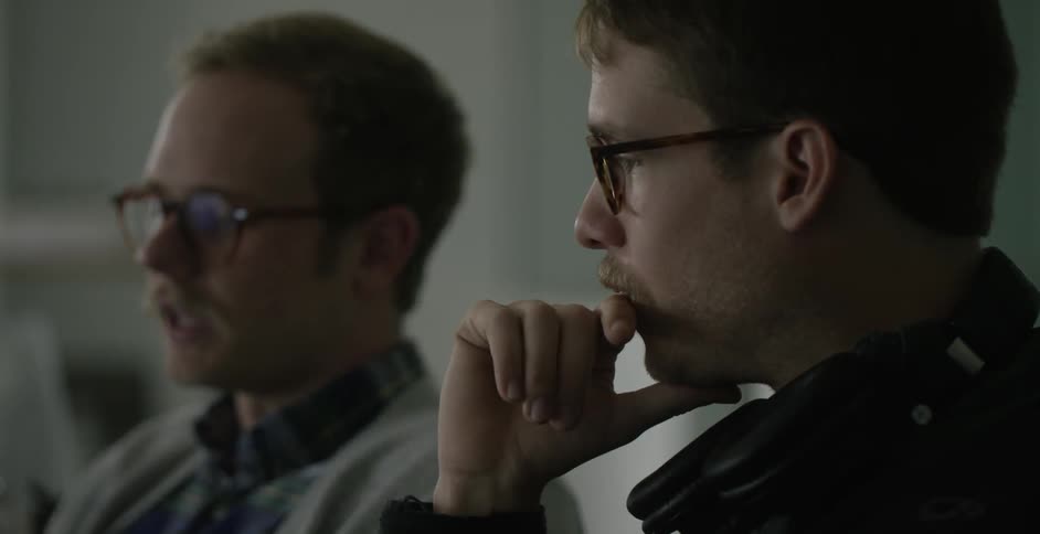 Two men sitting and talking
