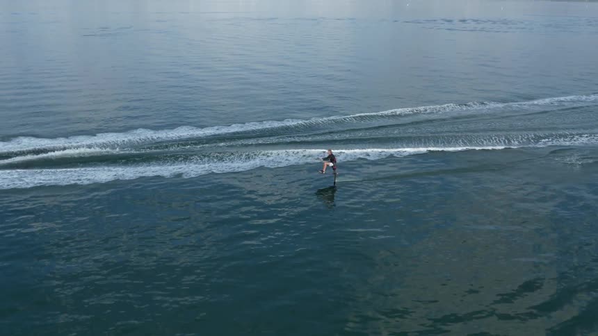 A boat pulling someone water skiing