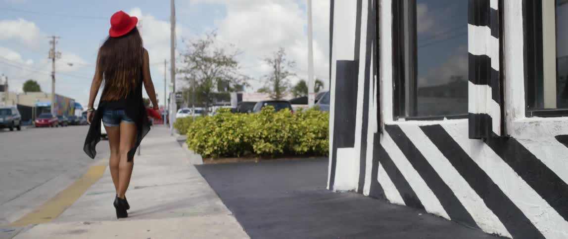 A person walking down the sidewalk