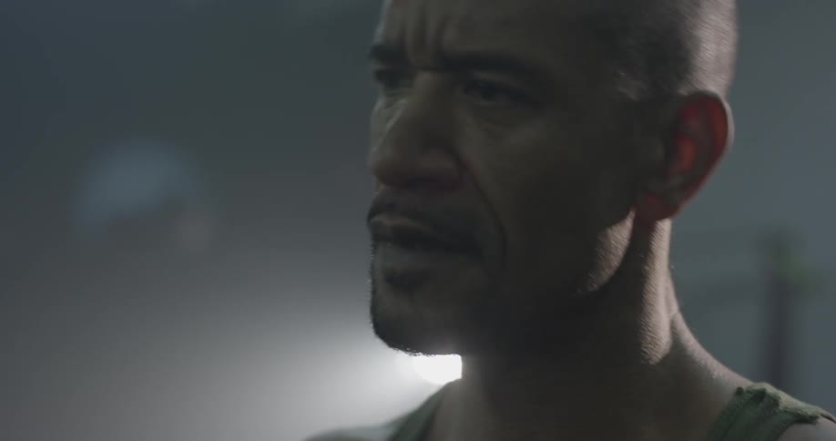 A man moves his head left and right to crack or stretch his neck