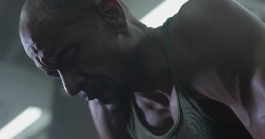 A man leans over to catch his breath