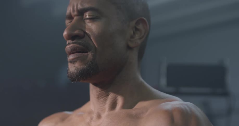 A man takes a deep breath in