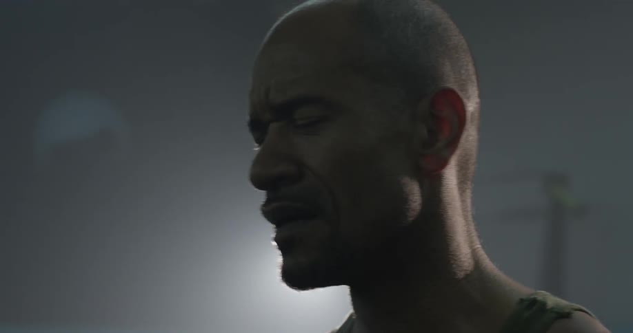 A man breathing hard in a gym