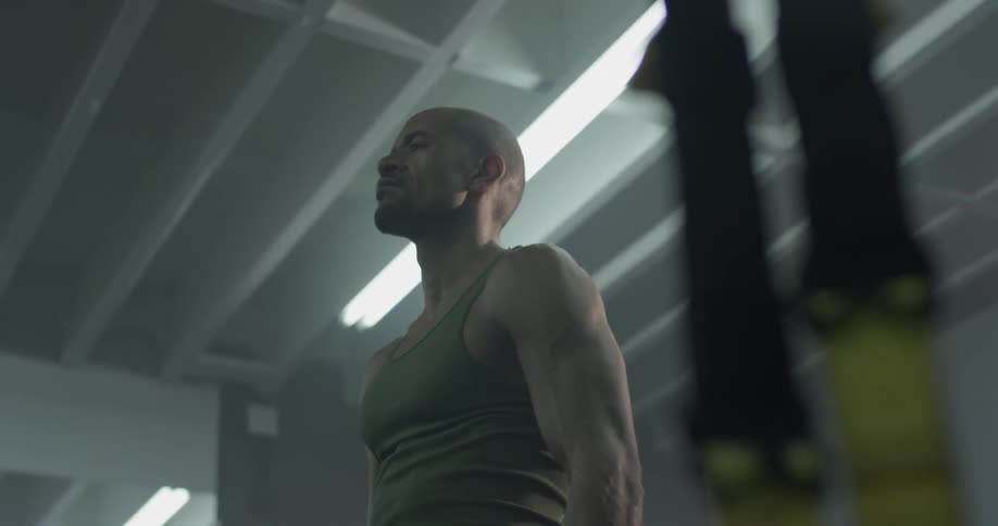 A man rocks back and forth inside the gym