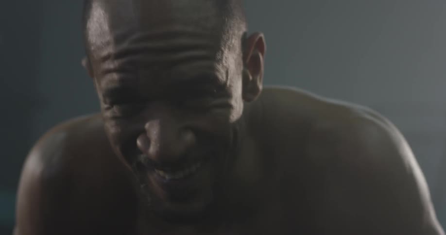 Man doing pushups in a gym