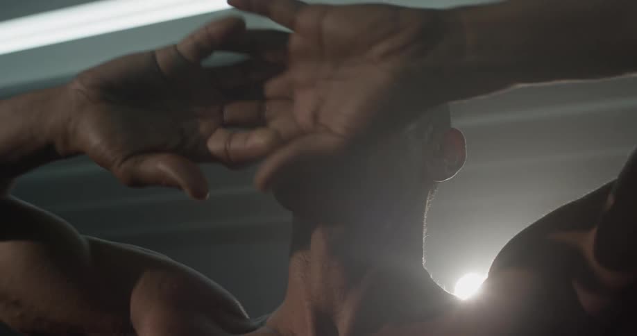 A man stretching in a gym
