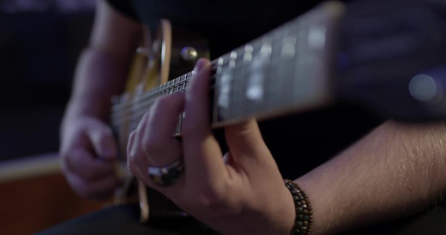 A man playing an electric guitar