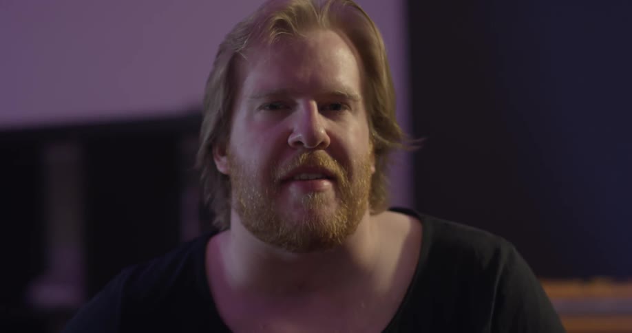 A man nods to music and looks up