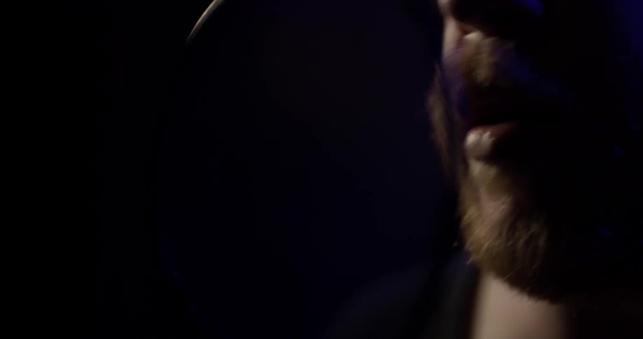 A man singing into a microphone