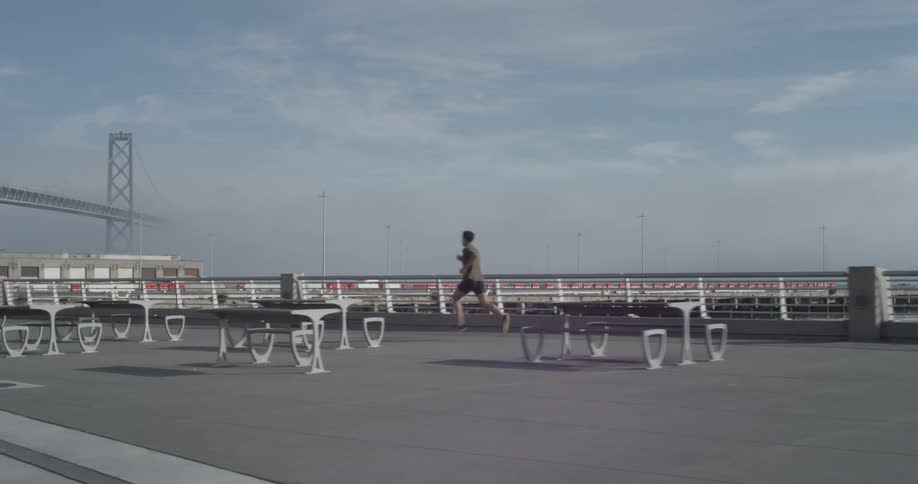 A man running down the sidewalk