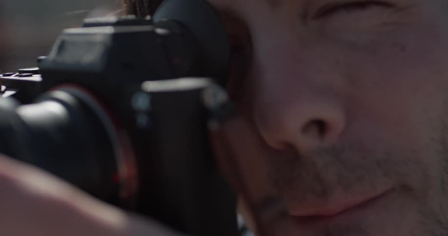 Man using a camera to take some photos