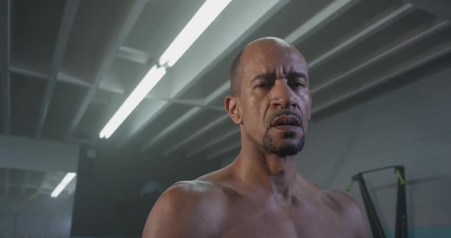 A man stretching in a gym