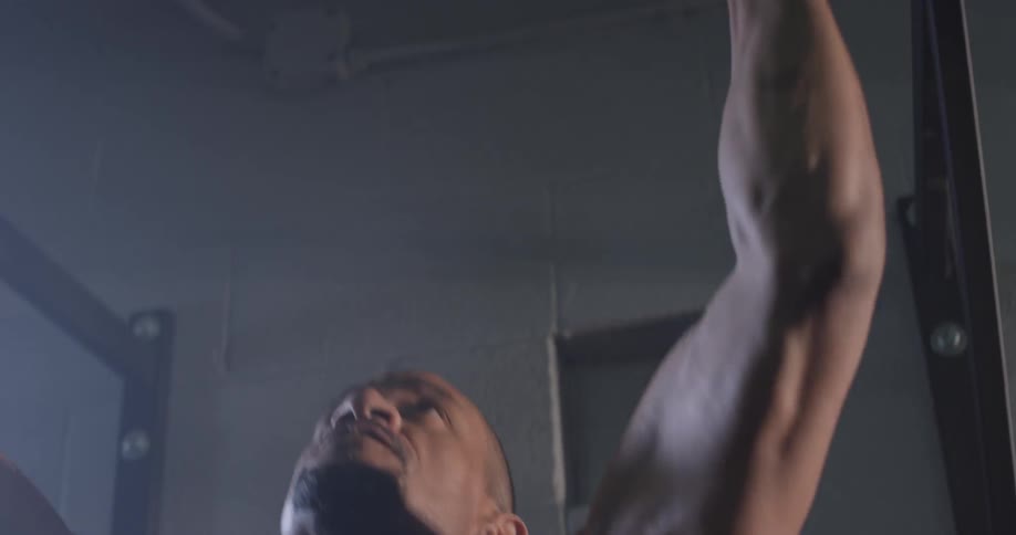 A man does chin ups