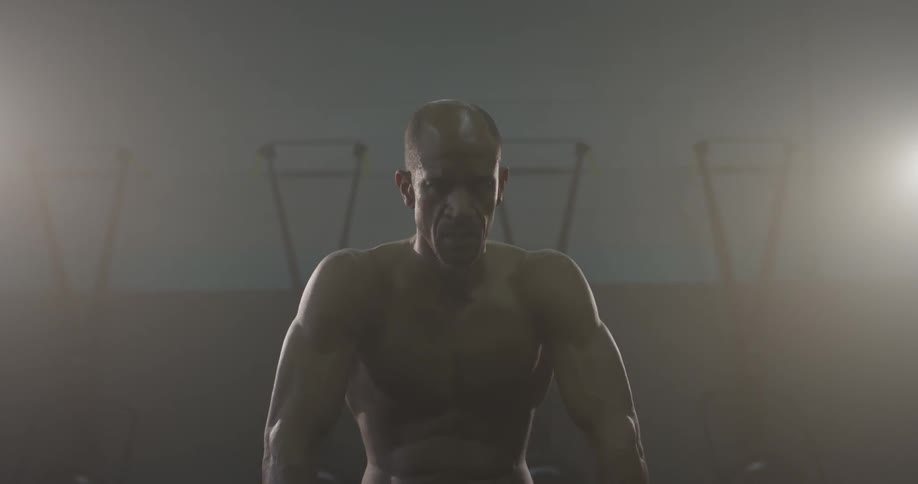A man flexing in a gym