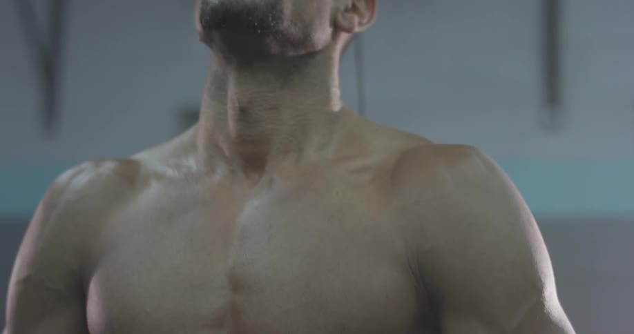A man is breathing heavy indoors