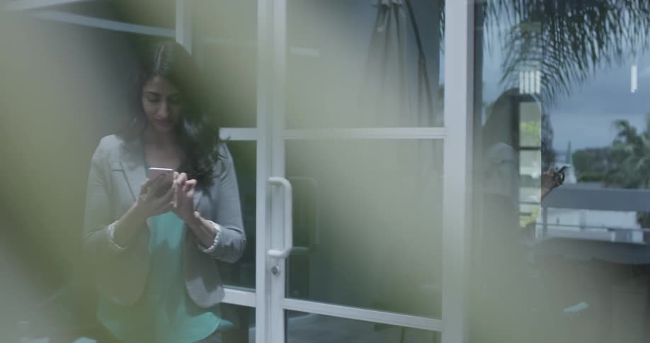 A woman is using her phone