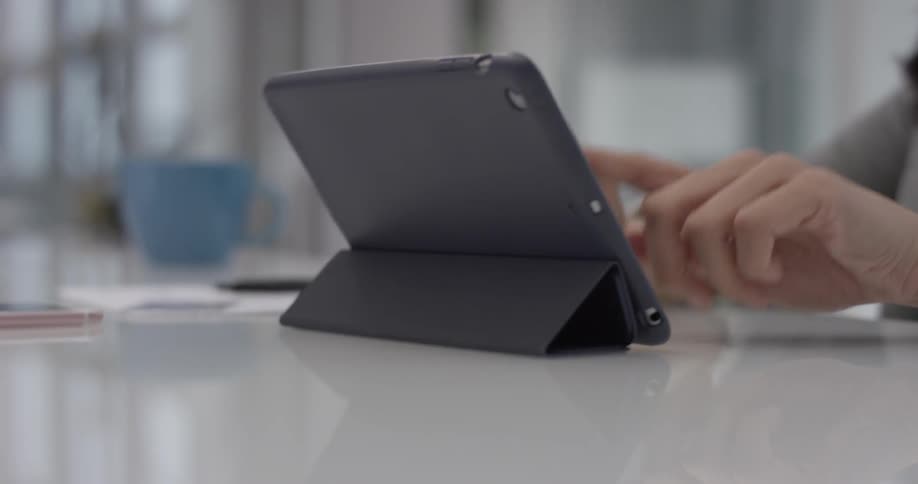 A person is touching multiple items on a tablet