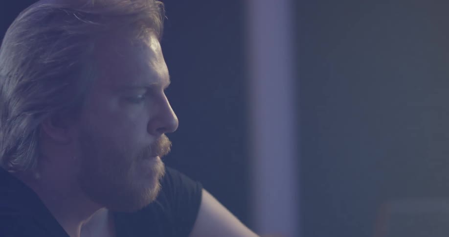 A man listening to music in a recording studio