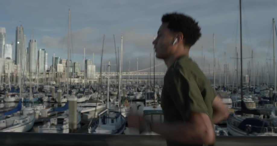 A man running along a pier