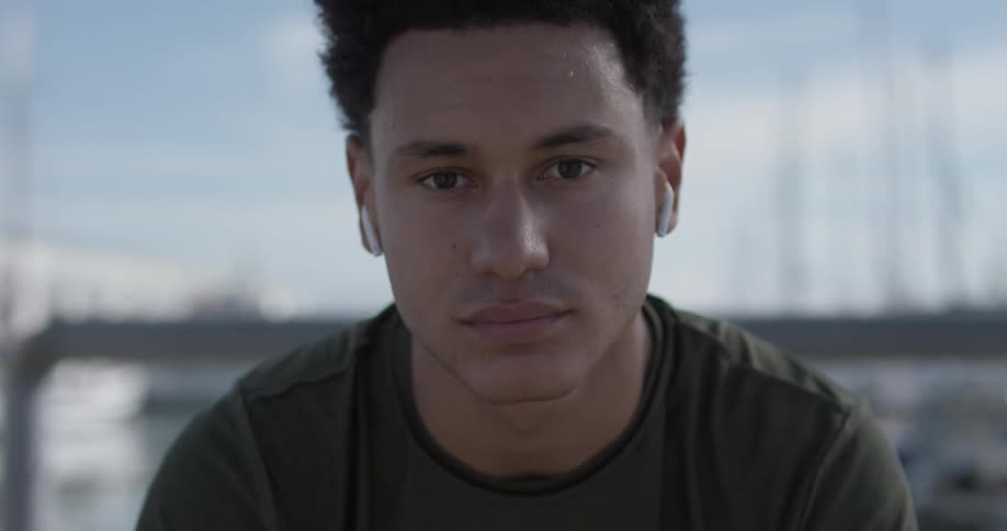 Man comes into focus looks up at camera