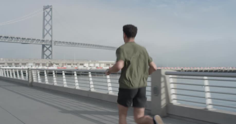 A man is jogging outside during daytime