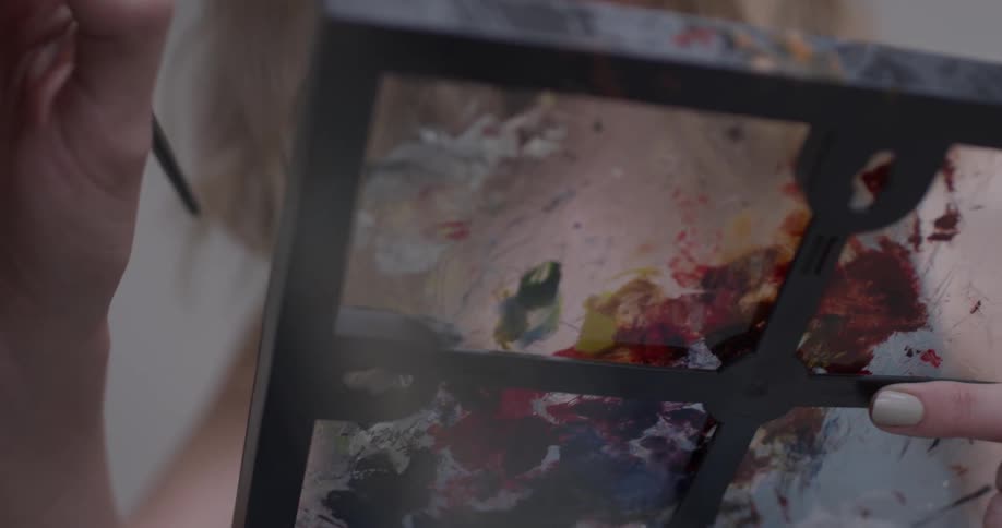 A person painting in an art studio