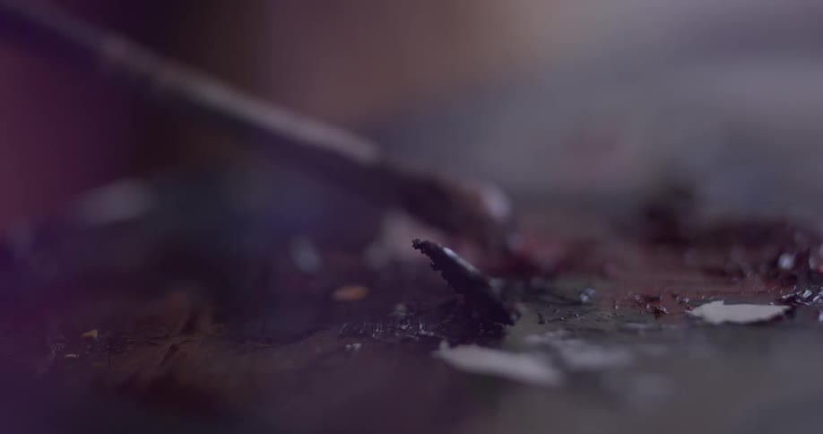 An extreme closeup of a paintbrush painting