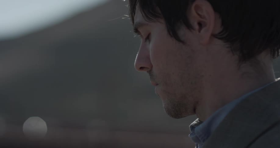 A man looking at things on a camera