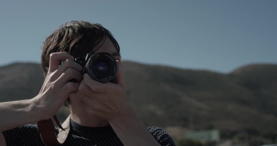Man using a camera to take photos
