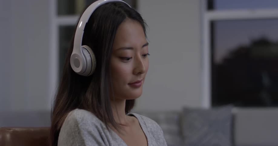 Woman wearing headphones listening to music